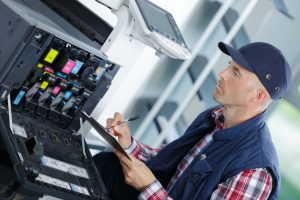 handyman fixing the office printer