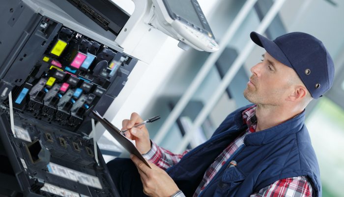 handyman fixing the office printer