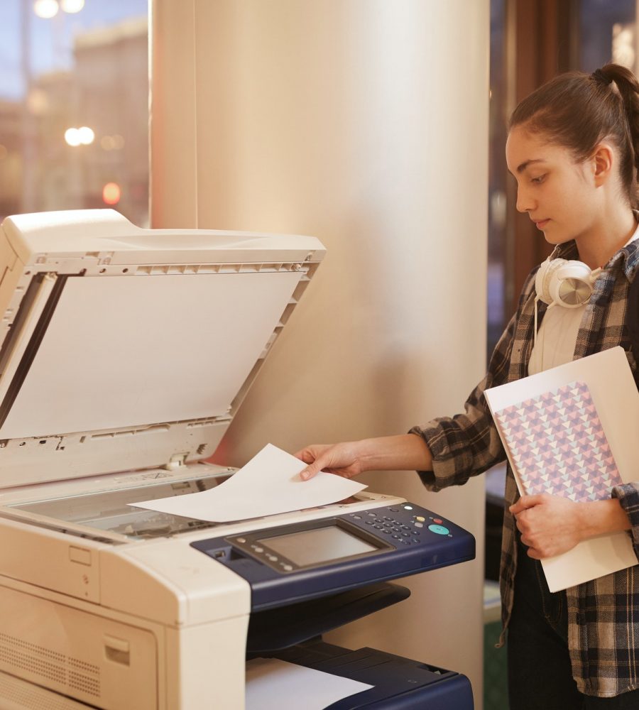 Student making copy of her report